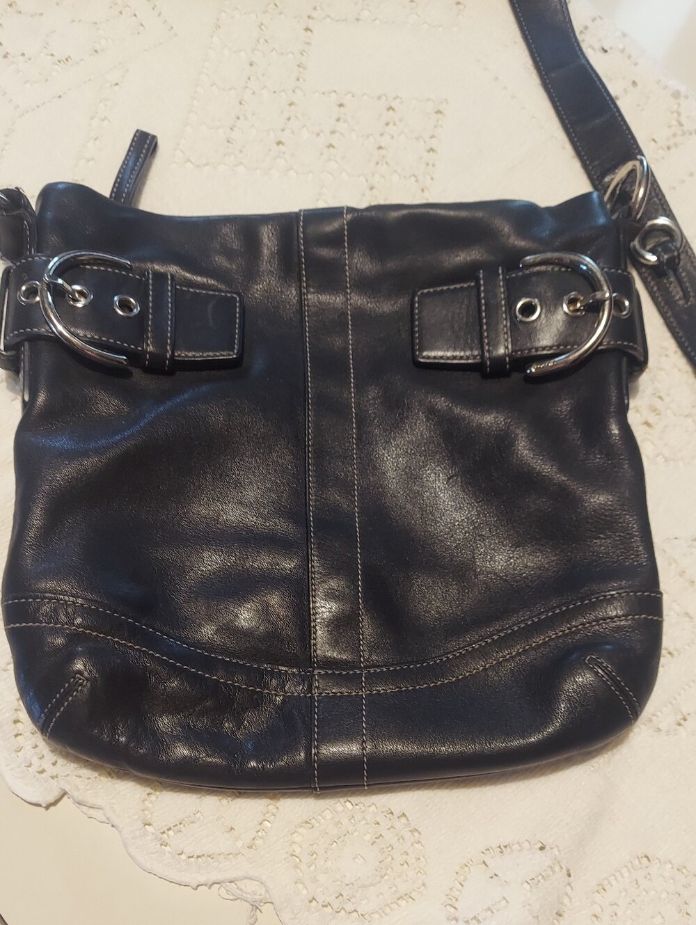 Coach 1452 Black Leather Crossbody Bag with Buckle Accent.